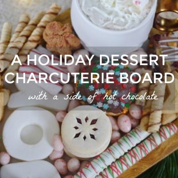 A HOLIDAY DESSERT CHARCUTERIE BOARD WITH A SIDE OF HOT CHOCOLATE