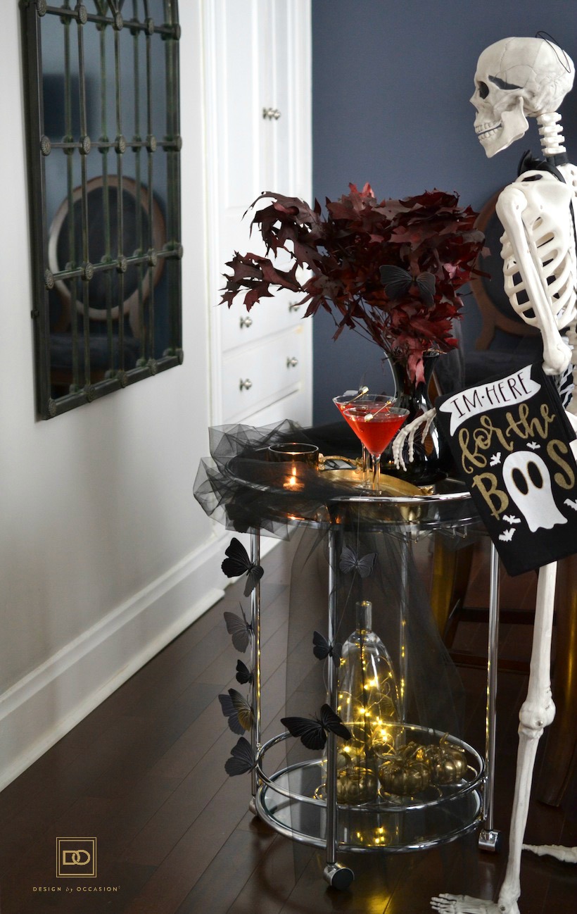 halloween cocktail and decorated bar cart